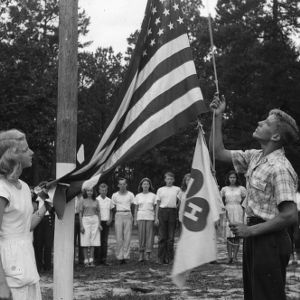 4-H club members raising the flag at Millstone 4-H Camp