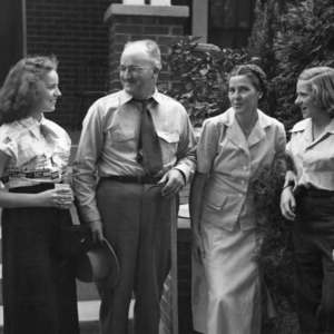 Three unidentified women and one unidentified man at 4-H Wildlife Camp