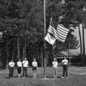 Reciting the Pledge of Allegiance under the American flag at Millstone 4-H Camp