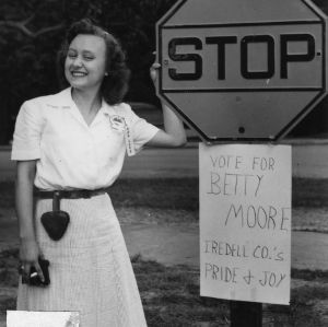 Betty Moore of Iredell County stands beside one of her campaign posters during the election for North Carolina State 4-H Council Officers