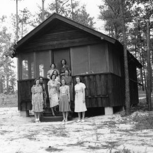Women standing in front of cabin at Millstone 4-H Camp