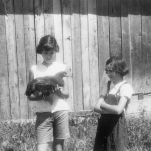 4-H club members the Kisco girls with chicken, Moore County, North Carolina, 1953