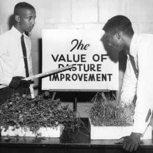 State 4-H demonstration winners William Brown and Cecil Brown with exhibit "The Value of Pasture Improvement"