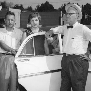 Henry Dameron and Julie Beam of Cleveland County 4-H Club poultry production demonstration team, with C. F. Parrish, 1960