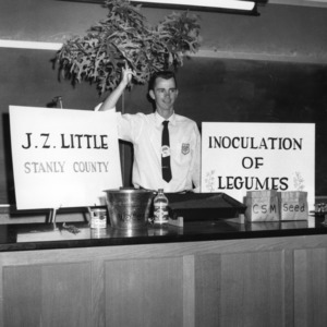 J. Z. Little of Stanly County with an exhibit on "Inoculation of Legumes" during North Carolina State 4-H demonstration competition