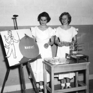 Two 4-H club girls performing a food preparation demonstration