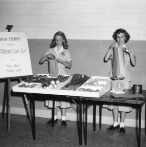 Faye Batts and Tempie Griffin of Nash County, North Carolina, performing a 4-H food preparation demonstration on vegetable selection
