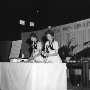 Two 4-H club girls giving a food preparation demonstration on vegetable salad