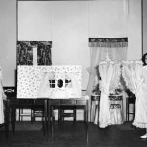 4-H girls performing a demonstration on curtains for the bedroom