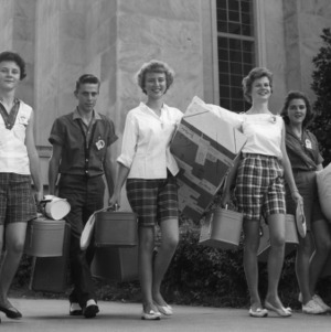 4-H club members carrying their luggage at North Carolina State 4-H Club Week, July 1959, at North Carolina State College