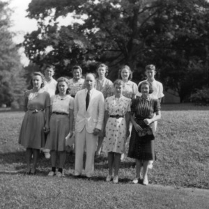 L. R. Harrill standing with 4-H club members while attending North Carolina State 4-H Short Course