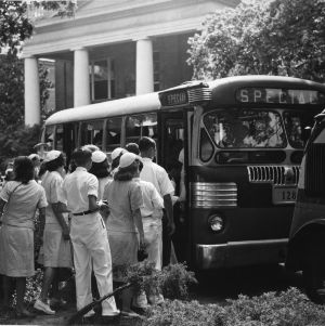 4-H club members boarding a bus at North Carolina State 4-H Club Week