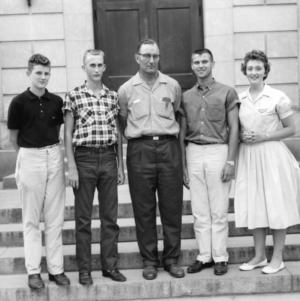 Four men and one woman posing during North Carolina State 4-H Club Week
