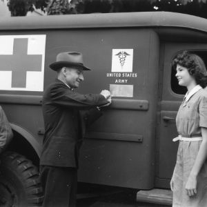 L. R. Harrill revealing the plaque placed on an ambulance donated to the United States Army Medical Department in honor of former 4-H club members now serving in the armed forces
