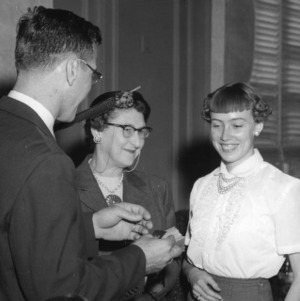 4-H club member receiving a ribbon