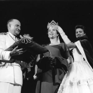 Winner of the national 4-H Dress Revue contest being crowned. To the left is L. R. Harrill, North Carolina State 4-H Club leader