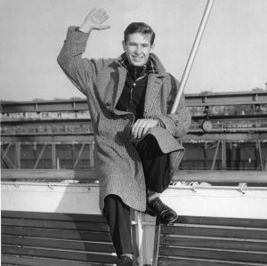 John Thomas James sitting aboard a cruise ship while participating in the International Farm Youth Exchange (IFYE) program