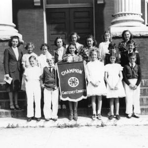 Contestants for the junior 4-H king and queen of health, the girl in the center carries a banner reading "Champion, Carteret County"
