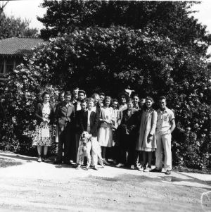 4-H Club members preparing to go on a trip to the Canadian World Fair. This picture was taken at Jack Miner's Bird Sanctuary near Kingsville, Ont., Canada. Mrs. Miner is seen just under the figure of the flying goose