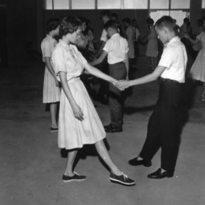 Two 4-H club members dancing together