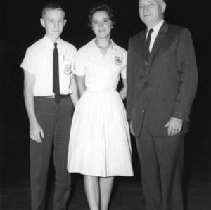 Robert Oglesby and Lima Hedgepeth, 4-H club poultry production team, with L. R. Harrill, North Carolina State 4-H Club leader, 1963