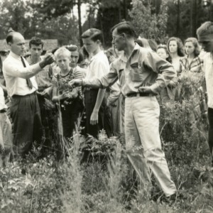 North Carolina State 4-H Club members and instructors standing in field