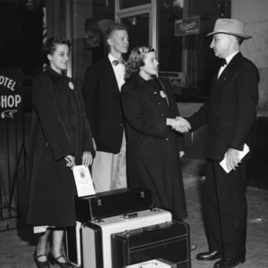 L. R. Harrill greeting members of the 4-H Club Farm and Home Electric Congress