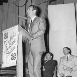 Cleveland County, North Carolina, 4-H Club automotive program leader speaking at podium, 1969