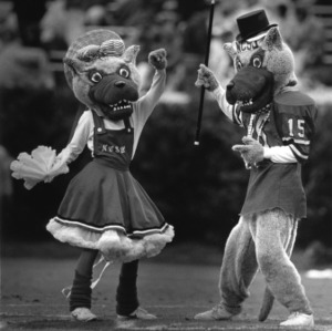 Mr. and Ms. Wuf dancing at N.C. State vs. University of Virginia football game