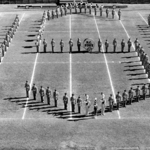 N.C. State marching band spelling out "NSC"