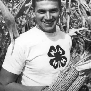 4-H club member with his corn crop