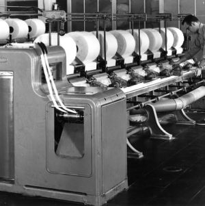 Man working with textile machinery