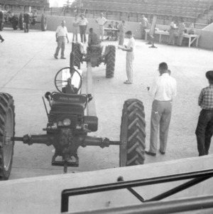Tractors lined up at a tractor contest on September 23, 1953