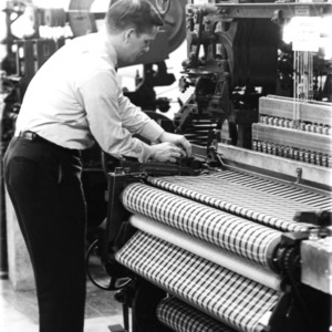 Man working with a loom?