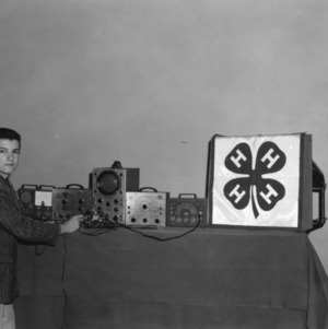 4-H club member giving electric demonstration