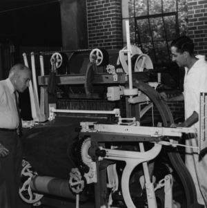 Professor Benjamin Whittier and a techincian looking at a loom