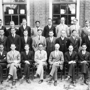 Group portrait of Textile faculty and students in front of Tompkins Hall