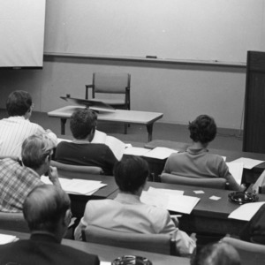 Unidentified textiles professor lecturing a class