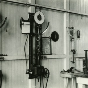 Old testing lab in Tompkins Hall prior to 1939 with scales and weighing equipment