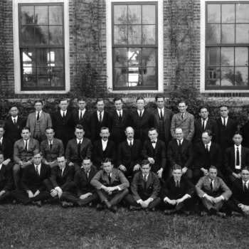 Textiles senior class of 1922 with faculty in front of Tompkins Hall