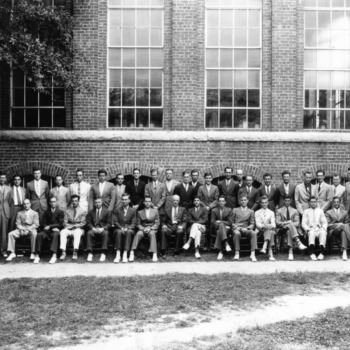 Graduating class at the Textile School of North Carolina State College in front of Tompkins Hall