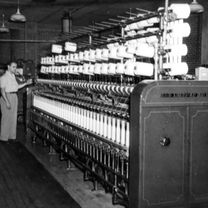 Man working with a spinning machine