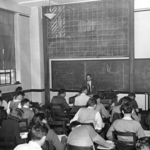 Professor lecturing a large class of students