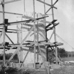 M. W. Jackson building a silo on his dairy farm near Edenton, North Carolina, September 28, 1926
