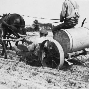 Machine used to assist in planting tobacco seedlings, ca. 1929