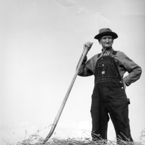 Farmer posing in a field