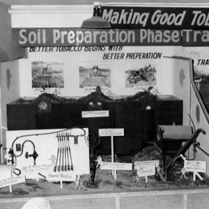 "Making good tobacco better" display showing the soil preparation stage