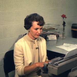 Woman working at a typewriter