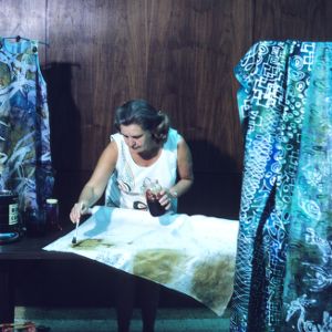Woman participating in arts and crafts fair (batik fabric)