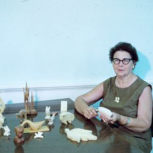 Woman participating in arts and crafts fair (wood carvings)
